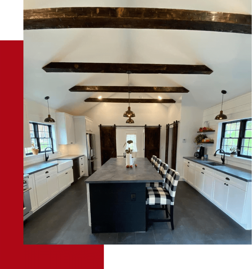 A photo of a kitchen with wood beams.