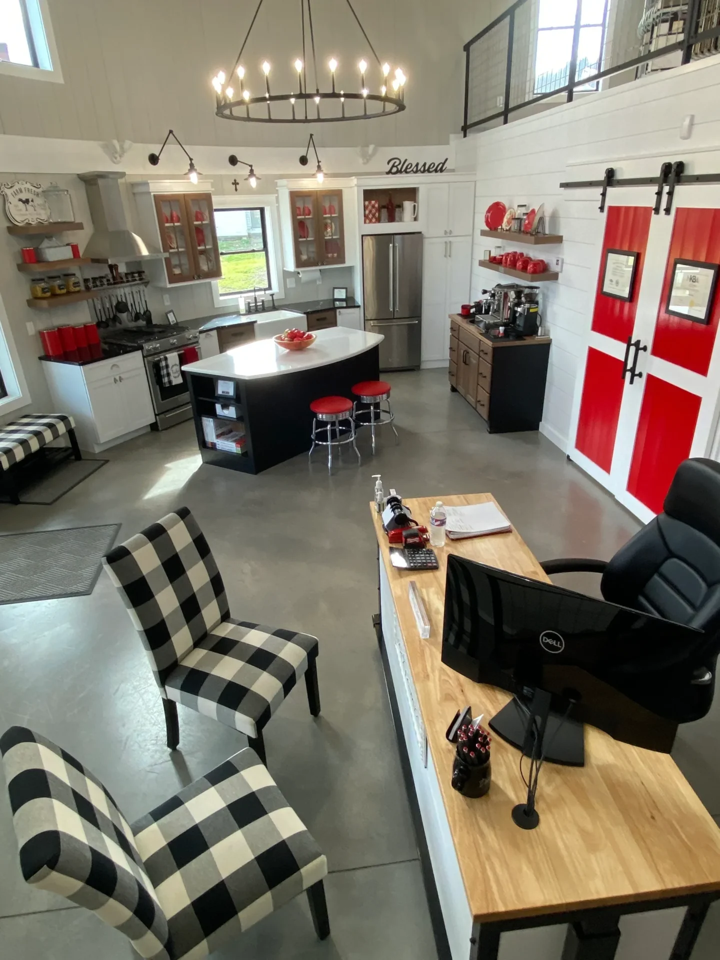 A kitchen with a red and black checkered table and chairs.